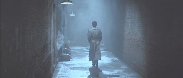 a stranger in a dark alley.