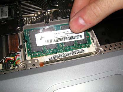 It s easier if you do them at the same time. The ram chip will pop up. Just slide out to remove it.