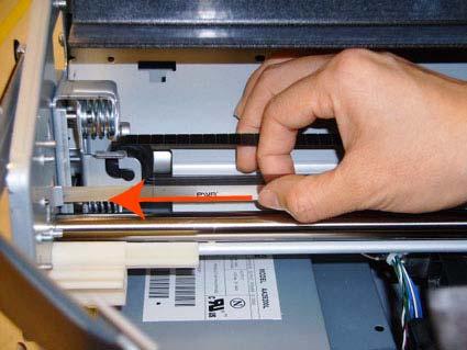 Remove the T-10 screw that secures Encoder Strip to the printer. 5.
