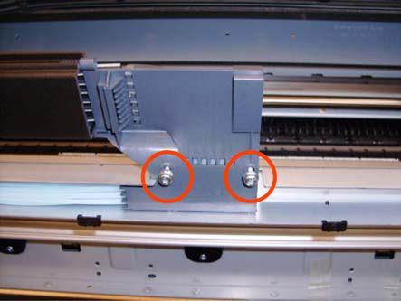 Remove the top T-15 screw that secures Ink Supply Tubes guide to the