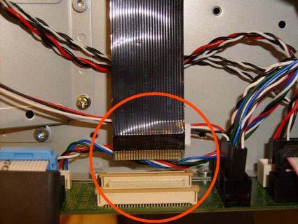 14. Disconnect the ribbon cable of
