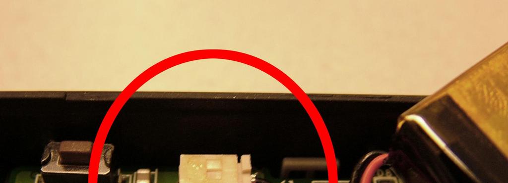 5 Fig. 5 Disconnecting the battery from the main board.