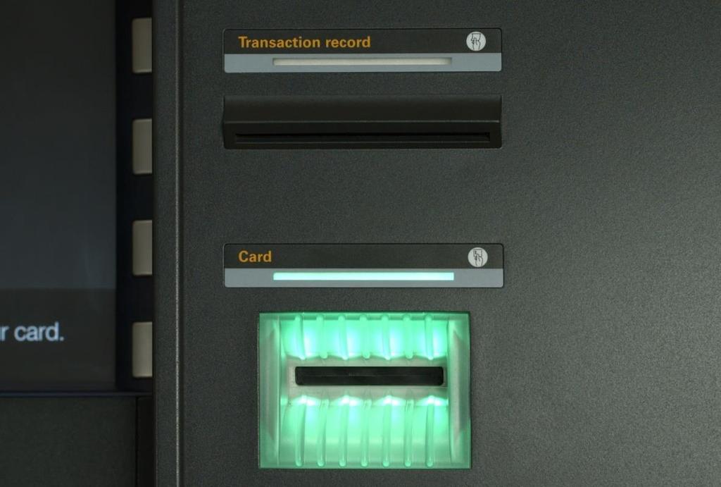 Figure 6. The receipt slot and, below it, the ridged card slot. Coin compartment Some ATMs that take deposits have a compartment for accepting coins.