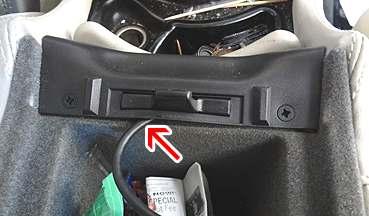 If the center armrest is the final destination, wire tie any extra cable and store it at the front end of the center armrest as seen in Fig.