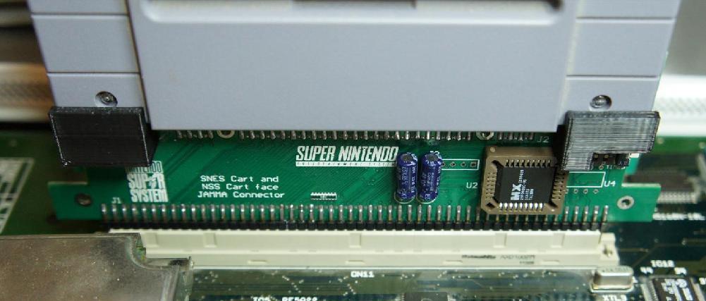Deluxe adapter included brackets to add additional support for the SNES/SFC