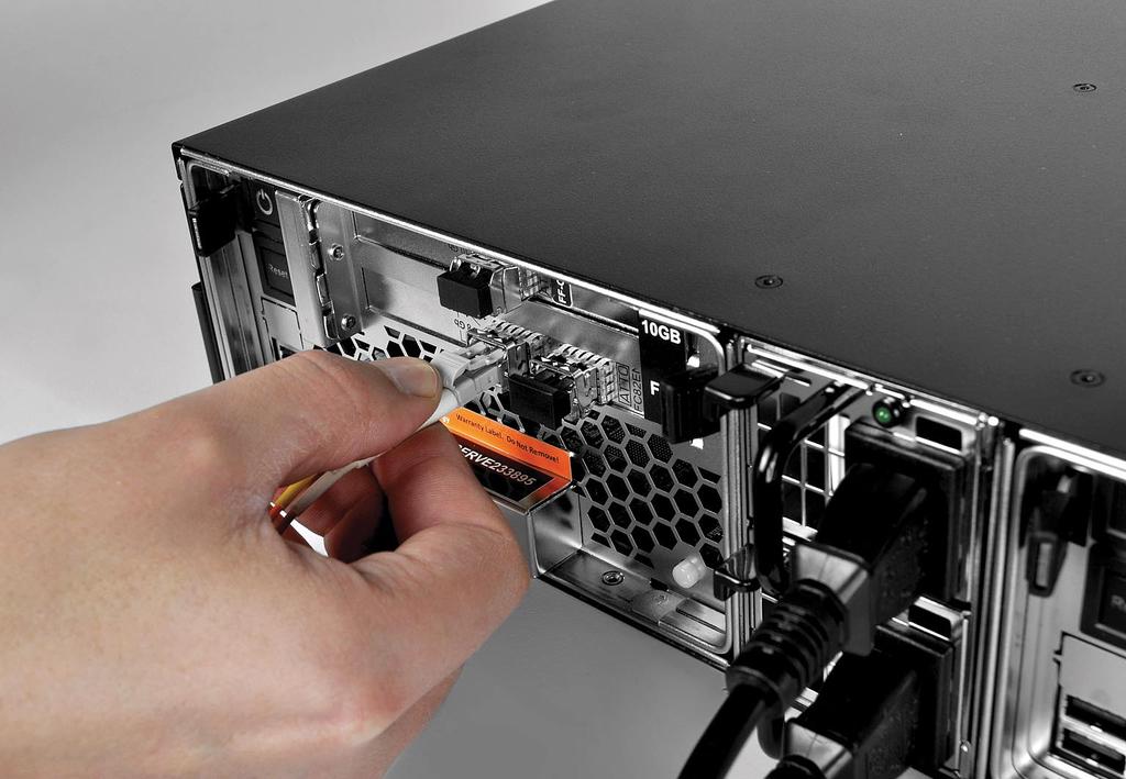 Tiger Serve Assembly Guide Site Installation: Cabling Tiger Serve 3. Plug one end of the fibre optic cable into the SFP socket of the FC port. 1. Remove the protective black cap from the 10GbE port.
