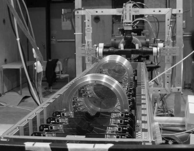 4.3 Target design and setup 65 Figure 4.5: Photograph from the test beam area, showing the opened detector half, with the 1 modules and the two target holders, with two rings each.