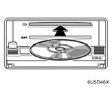 AUDIO SYSTEM CAUTION 2. Insert a disc. 3. Push the button to close the display. After insertion, the set disc is automatically loaded. If the label faces down, the disc cannot be played.
