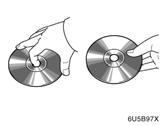 AUDIO SYSTEM " Correct " Wrong D Handle discs carefully, especially when you are inserting them. Hold them on the edge and do not bend them.