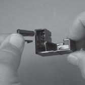 3. Remove one screw (callout ), and then remove the black-plastic retainer (callout ).