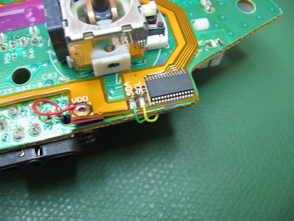 Connect the green and yellow wires from the modchip to the flexible add-on board.