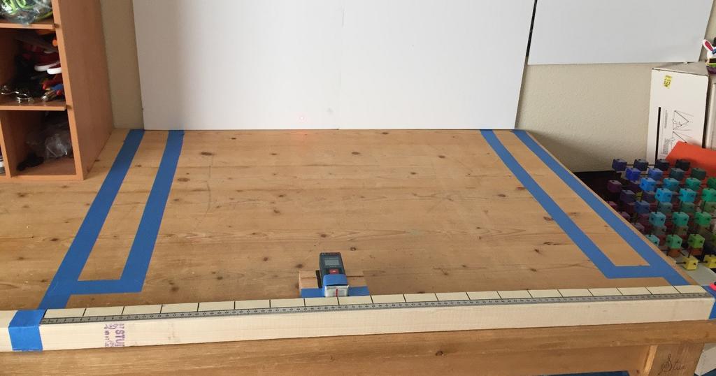 Create a back wall with foam core or use an actual wall. Attach the reference track (2" x 2" x 40" board) to the table edge closest to you.