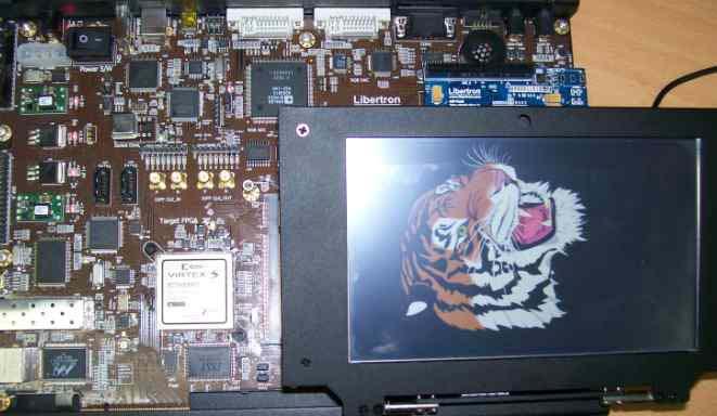 1 on an FPGA kit with Xilinx xc5vsx95t, as shown in Fig. 2 (b). The systemon-a-chip platform presented in [3] was used in the verification.
