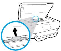 b. Locate any jammed paper inside the printer, grasp it with both hands and pull it towards you.