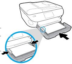 2. Load paper. Insert a stack of paper into the paper tray with the short edge forward and the print side down. Slide the paper forward until it stops.