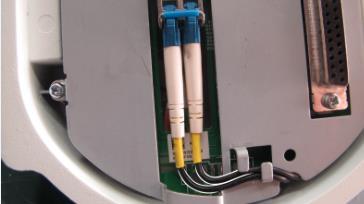 If the optical fiber is too long, coil the optical fiber.
