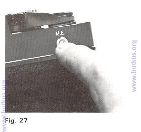 2. For the second exposure. advance Film Advance Lever ( 1 1 ) while keep pressing Multi-exposure Button (25) firmly with the other hand (Fig. 27).
