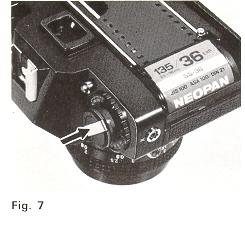 4. Push down Film Rewind Knob (1) to its original position by turning Film Rewind Crank (2) clockwise or counterclockwise so that Film
