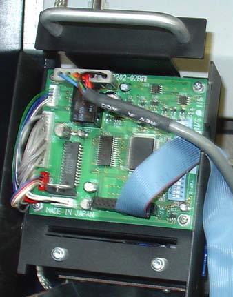 Insert the presenter assembly on the screw and start the other. DO NOT tighten the phillips head screws at this time.