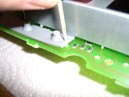 4) Assembly of switches and backlight lamps Using the provided toothpick, insert one end into the hole on the topside of the switch and place