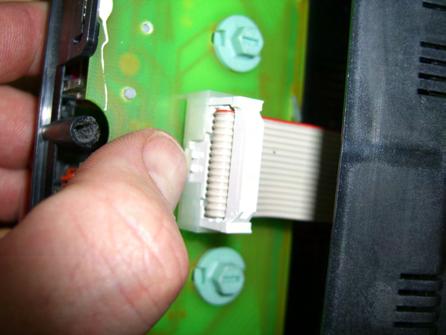3) Removing the circuit board from the plastic switch panel Gently pry outwards on the socket s retaining tab with your thumbnail or flathead screwdriver as shown.