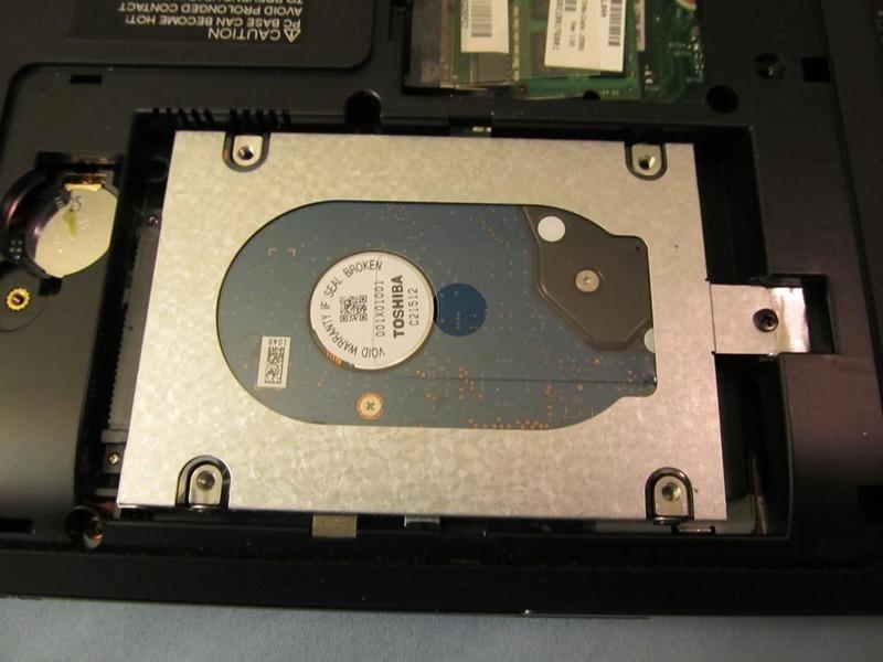 Step 7 Next, remove the single screw holding the hard drive in place (it's located on the right).