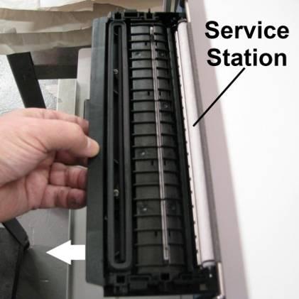 Ink Tank Door Service Station Slot 3. Power-up the printer. 4. Open the Printer Toolbox. In the User Interface window, press the Eject Service Station button. 5.