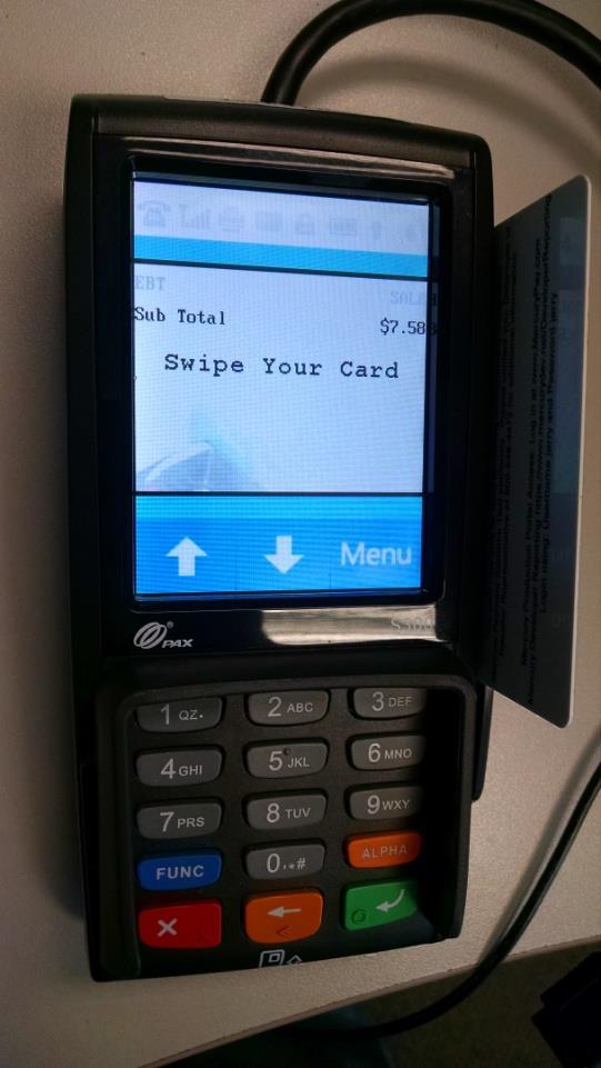 3. Swipe the EBT card on the right side of the S300 with the stripe facing down and