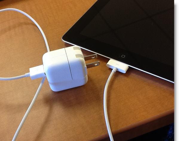Follow these directions for charging your ipad: 1. Plug the syncing cable s USB end into the AC adapter. (See to the right.) 2.