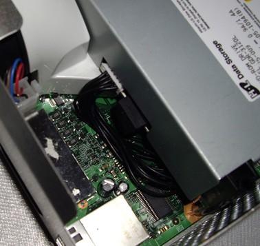 [Pic 1b] 2. Once you have removed the ODD you will see two cables plugged into the Xbox 360 motherboard [Pic 1c].