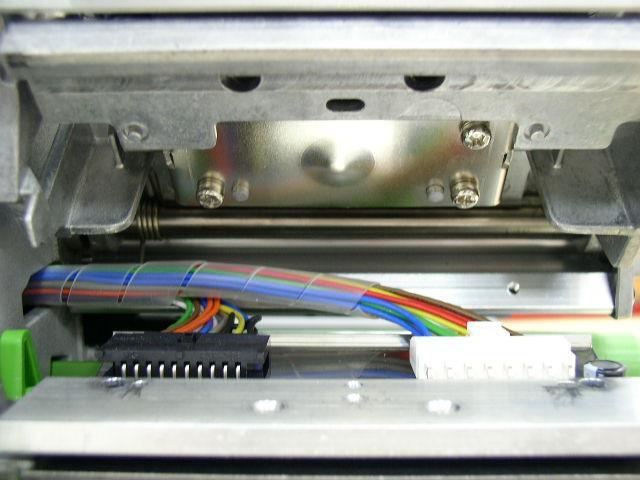 Remove the screw upon the print head mechanism. Screw 5. Carefully disconnect connector from the print head ASS Y.