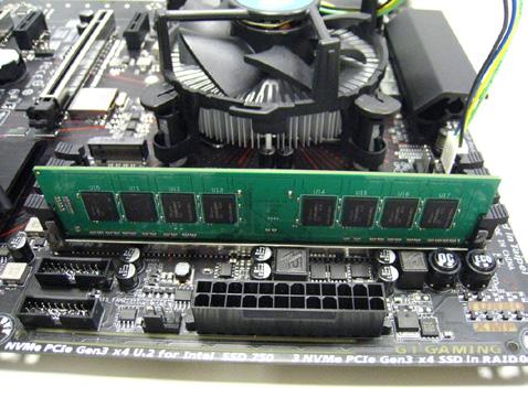 Spread the retaining clips at both ends of the memory socket. Place the memory module on the socket.