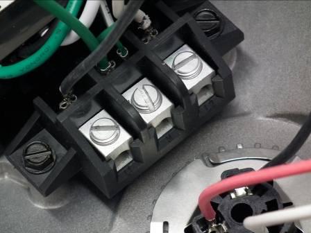 4. Locate the 120-277VAC fixture supply wiring and terminal block. If the fixture wiring adheres to NEC standards, this will be a black/white conductor pair.