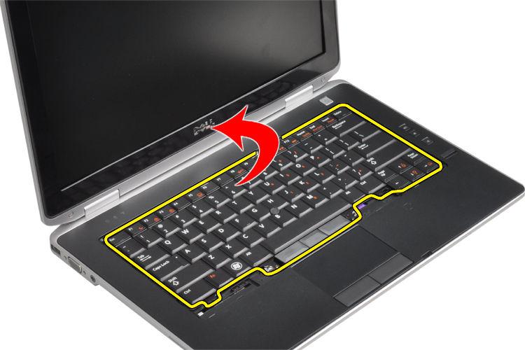 Lift and turn the keyboard to access the keyboard cable.