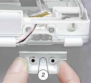 When the computer is positioned upside down, as shown below, the left clutch cover is labeled "1"; the right