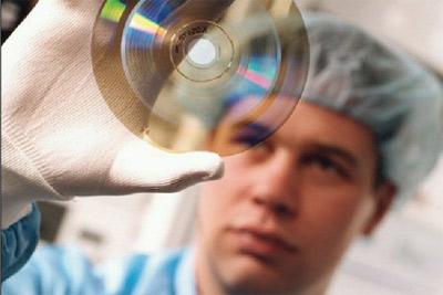 The recording layer is added to one of the discs. 3. The two discs are glued together. Blu-ray discs only do the injection-molding process on a single 1.1-mm disc, which reduces cost.