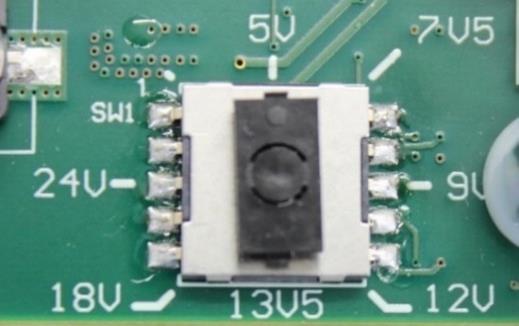 Turn the switch inside the voltage selector until the white dot points to the right voltage for your devices. 4.