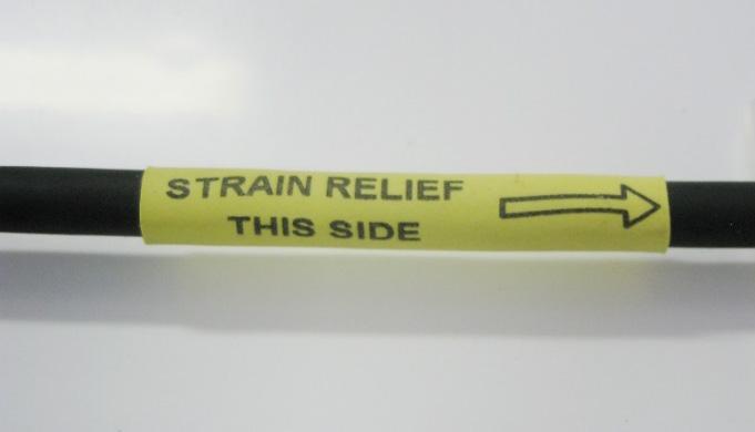module. FIGURE 7-2. Strain Relief Label on the CS240 Cable NOTE 7.