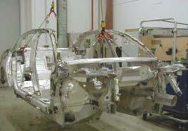 Fig. 1: Car body being cut into pieces for destructive testing As state-of-the-art in industrial X-ray inspection for large objects there are radioscopy systems providing two dimensional projective