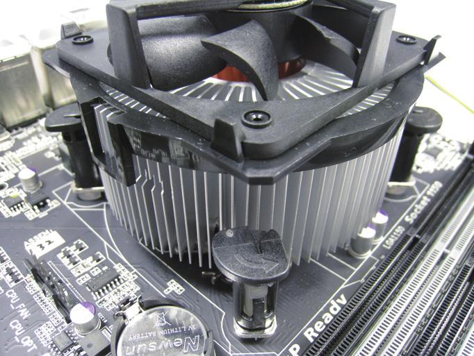 ) Step 3: Place the cooler atop the CPU, aligning the four push pins through the pin holes on the motherboard.