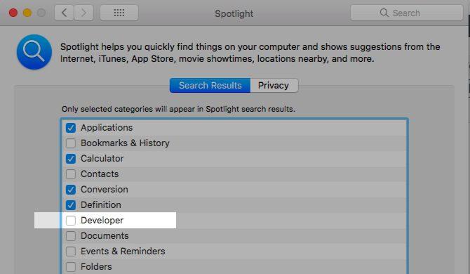 Deselect the category to stop it from showing up in Spotlight search.