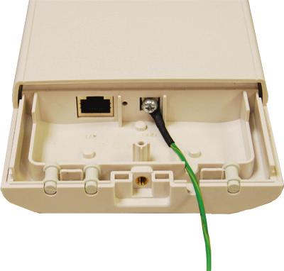 Remove the screw on the grounding point at the bottom of the Wireless Ethernet Extender. Figure 3-4. Grounding point on the extender. 2.