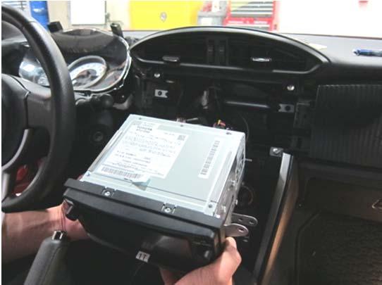 Install the Receiver Assembly Radio Unit (Vehicle mounting). (a) Insert the radio into the dash (Fig. 8-1). Fig.