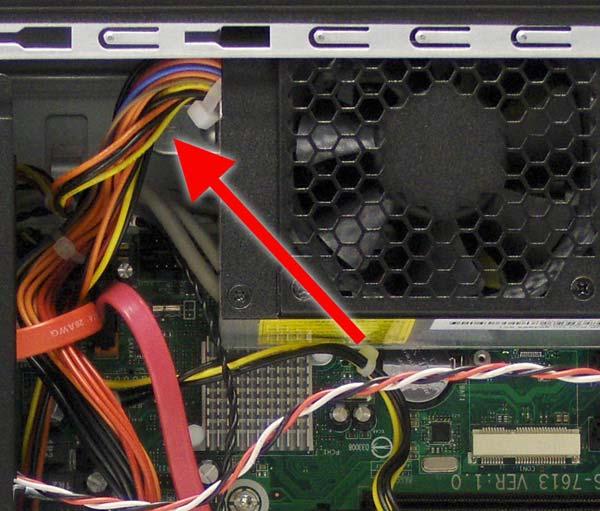 5. Press down on the tab in front of the power supply on the inside of the chassis. Figure 6-36 Power supply tab 6.