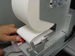 upward 4) Roll up the receipt paper roll backward, as shown in the