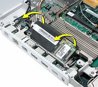4. Tilt up the modem and metal shield to remove them from the
