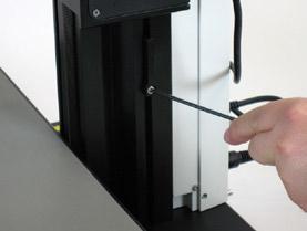Restricting the bottom travel range 1. Move the motorized focus into the lowest position you want to reach. 2. Unscrew the screw of the limit stop on the side of the focusing column. 3.