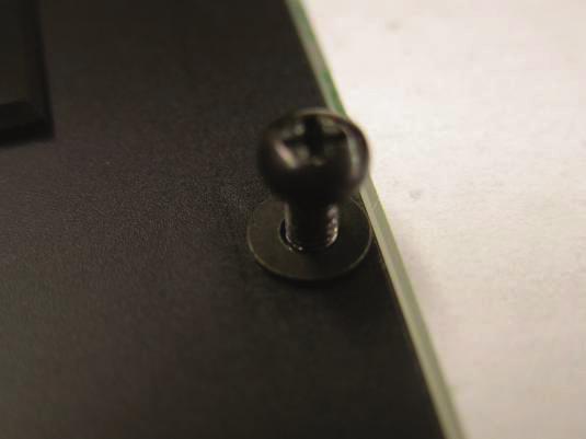 rounded head screws (4) with washers under them (5)