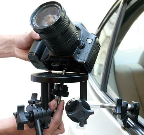 Attach mounting clamp to your car door and tighten properly.