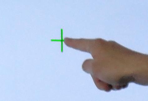 Touch small cross on the screen until it becomes green then remove your finger. If Cross is still black, remove your finger and approach it again.
